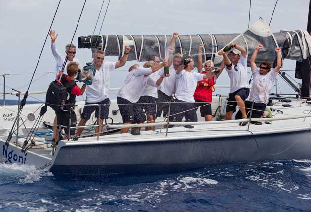 The crew of Ngoni, with skipper Kevin Sproul extreme left behind the cameraman, celebrate victory in the Soto 40 division of the Audi MedCup off Cartagena.