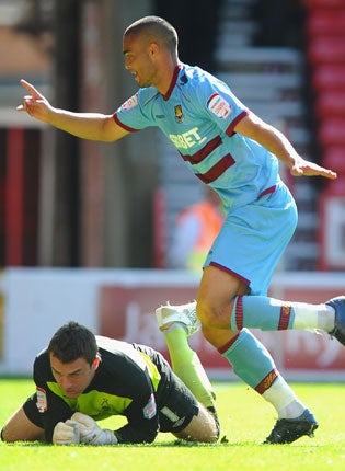 West Ham's Winston Reid celebrates scoring at the City Ground