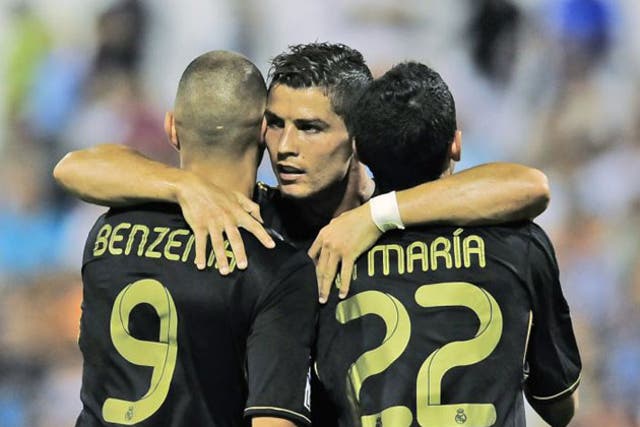 Cristiano Ronaldo (centre) celebrates his hat-trick in Real Madrid's 6-0 win