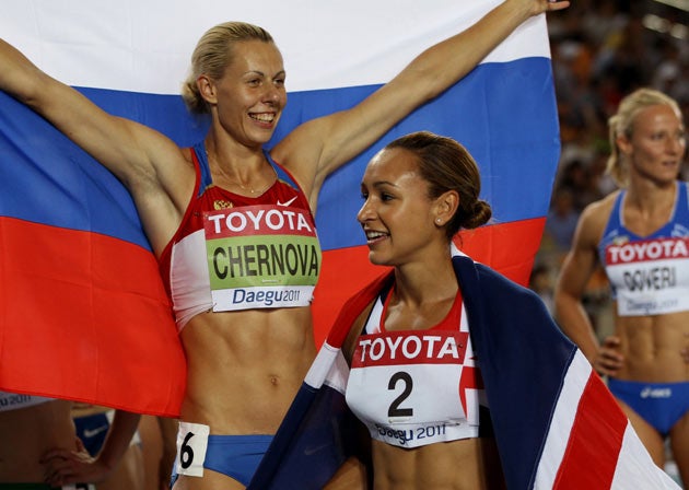 Ennis celebrates in front of gold medallist Tatyana Chernova