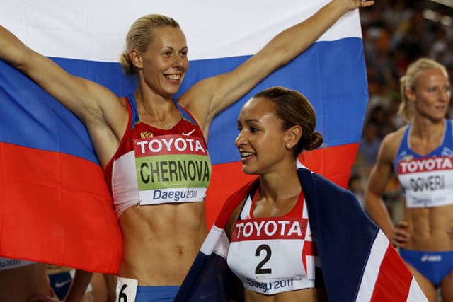 Ennis celebrates in front of gold medallist Tatyana Chernova