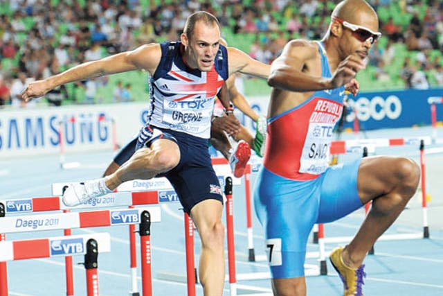 Dai Greene (left) makes up lost ground on his way to gold in the 400m hurdles