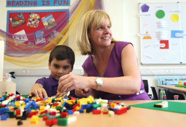 Principal Nicola Perry with six-year old Areeb Azeem on the first day of
Aldborough E-ACT Free School in Redbridge, east London
