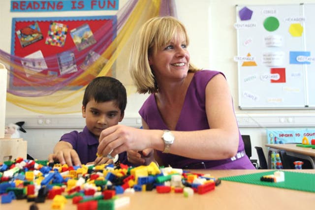 Principal Nicola Perry with six-year old Areeb Azeem on the first day of
Aldborough E-ACT Free School in Redbridge, east London