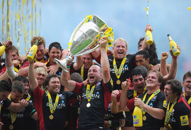 Saracens' Steve Borthwick lifts the Premiership trophy after his side beat Leicester in last season's play-off final at Twickenham