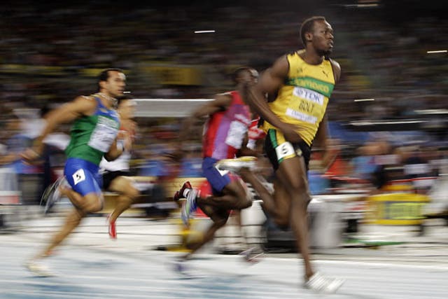 Usain Bolt (right) cruises through his 200m semi-final in 20.31sec to book a place in today's final