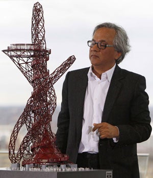 Anish Kapoor with a model of the ArcelorMittal Orbit tower which he designed with the help of three-dimensional computer imaging and will be the centrepiece of the Olympic Park in Stratford