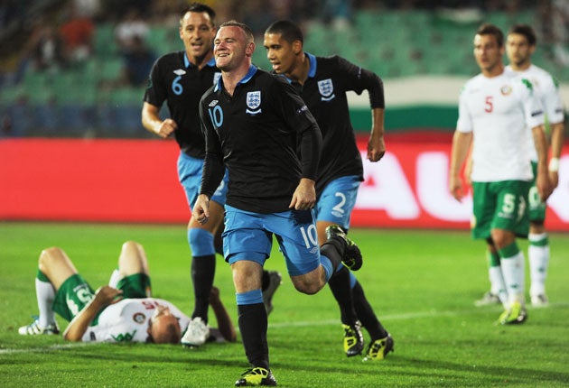 Wayne Rooney celebrates scoring the first of his two goals for England in Sofia last night