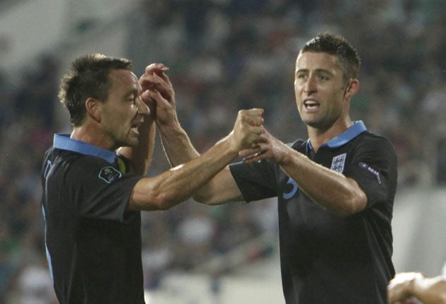 Gary Cahill (right) is congratulated by England team-mate John Terry after scoring the opening goal against Bulgaria in Sofia last night