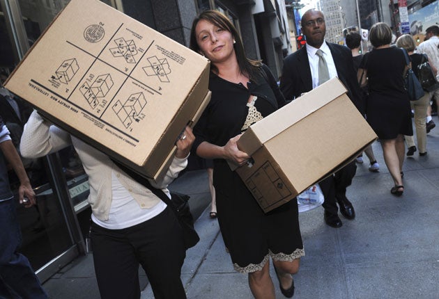Workers carry boxes from Lehman Brothers on 15 September 2008
