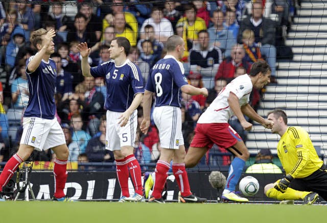 Scotland's Christophe Berra, Gary Caldwell and Scott Brown see their first-half lead cancelled out by Jaroslav Plasil, who scored with his stomach