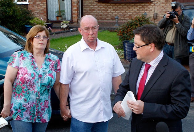 Linda and David Leighton, parents of nurse Rebecca Leighton, with their solicitor Carl Richmond outside the family home in Stockport