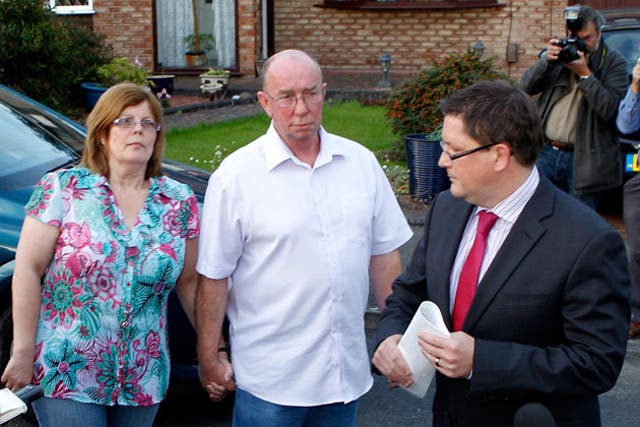 Linda and David Leighton, parents of nurse Rebecca Leighton, with their solicitor Carl Richmond outside the family home in Stockport