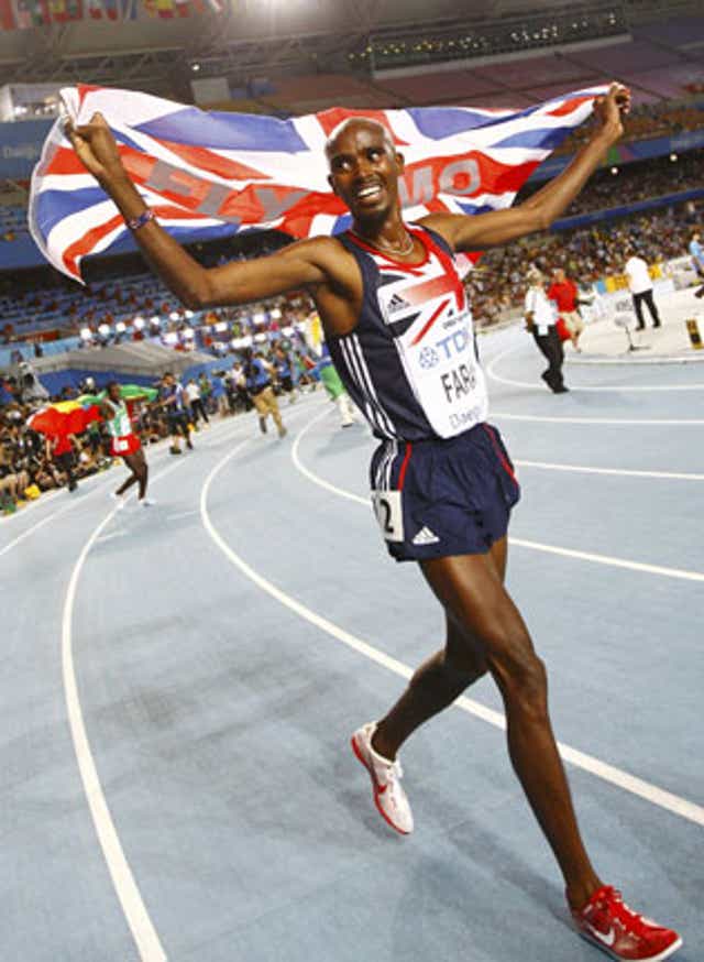 Britain's Mo Farah celebrates after winning gold in the 5,000m at the World Athletics Championships