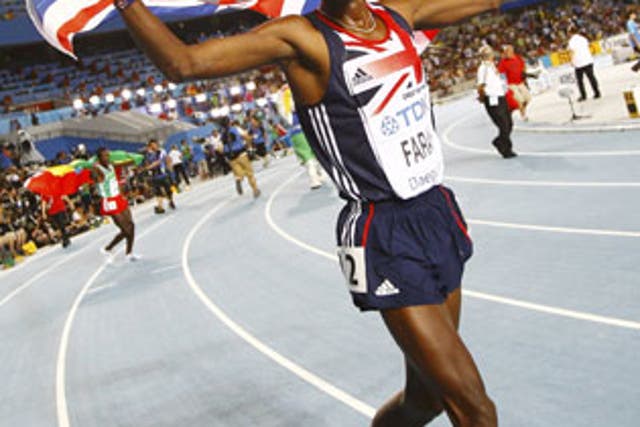 Britain's Mo Farah celebrates after winning gold in the 5,000m at the World Athletics Championships