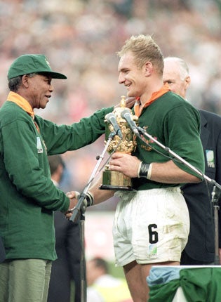 Nelson Mandela, the then President of South Africa, congratulates Francois Pienaar following the Springboks' extra-time victory over New Zealand at the 1995 World Cup final in Johannesburg