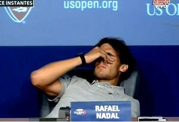 Rafael Nadal slumps in his chair during an attack of cramp at his press conference following victory over David Nalbandian last night