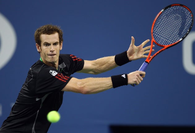 Andy Murray returns a shot against Feliciano Lopez of Spain
