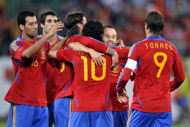 Fabregas is congratulated after scoring the winner for Spain against Chile