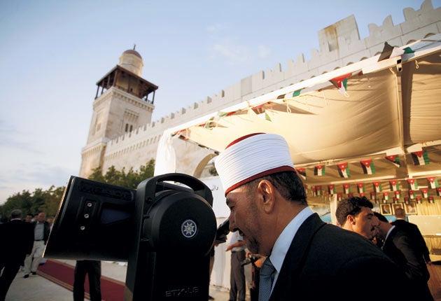 A Jordanian Muslim cleric observing the new moon that marks the start of Eid