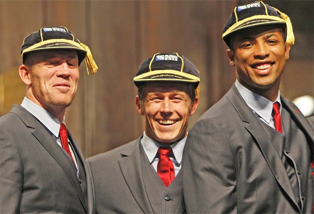 Mike Tindall, Jonny Wilkinson and Delon Armitage don their Rugby World Cup caps