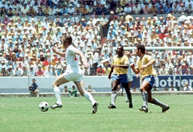 Astle in action for England against Brazil