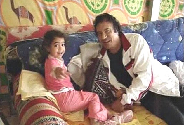 In this remarkable series of images, taken from an amateur video
shot in 2005 that emerged yesterday, Muammar Gaddafi can be
seen relaxing with his grandchildren in his tent at the Bab al-Aziziya compound in Tripoli