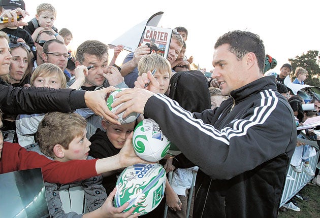 Dan Carter is mobbed by fans ahead of the start of the World Cup