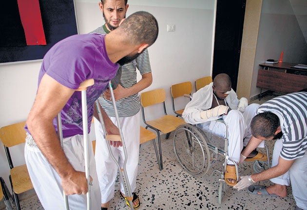Pro-Gaddafi fighters recuperate at a hospital in Tripoli