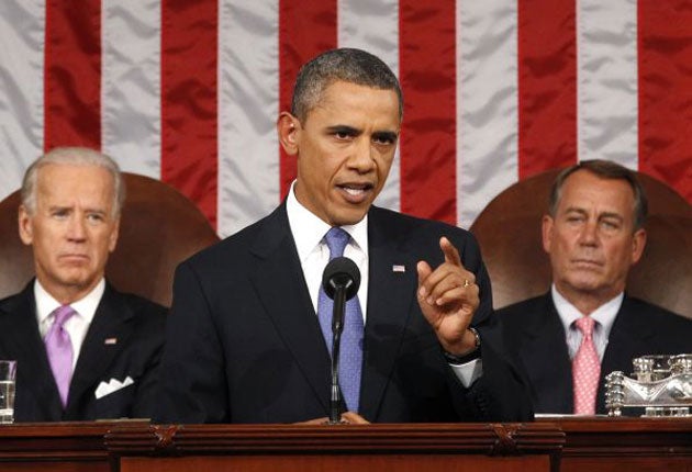 Obama delivers his speech to  Congress, flanked by Vice President Joe Biden (left) and House Speaker John Boehner