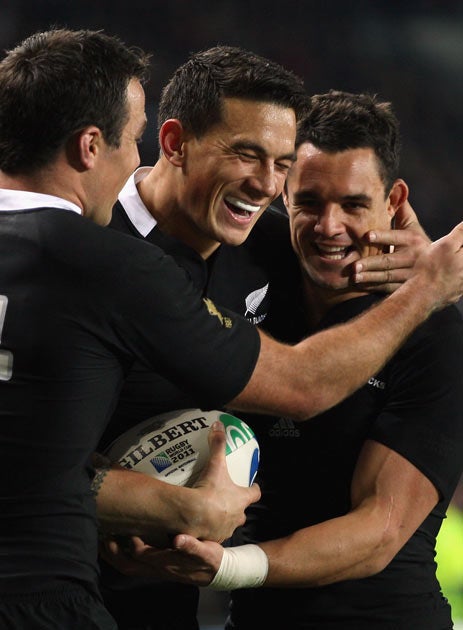 Sonny Bill Williams of the All Blacks celebrates scoring his try with Dan Carter and Richard Kahui