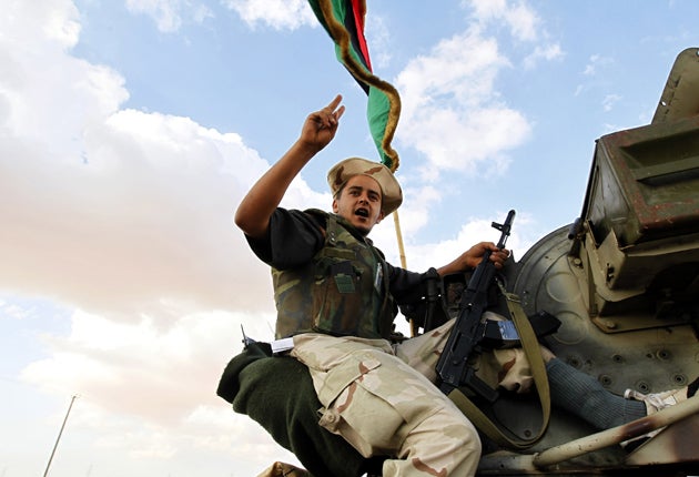 A Libyan rebel fighter near the Gaddafi stronghold of Bani Walid yesterday
