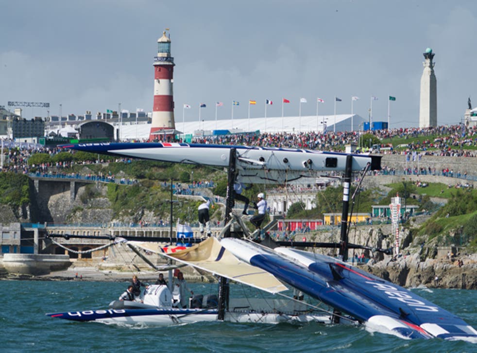 Over she goes. The Aleph team from France flips its wing-powered
trimaran in front of the watching audience on Plymouth Hoe