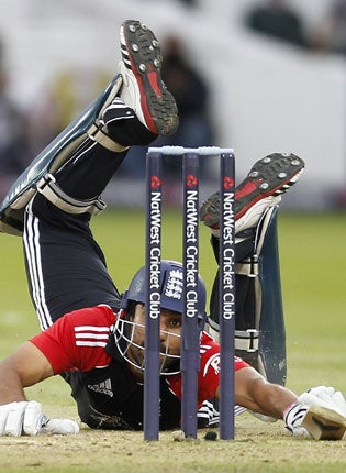 Ravi Bopara, who hit a brilliant 96, dives back into his crease after being sent back by Graeme Swann