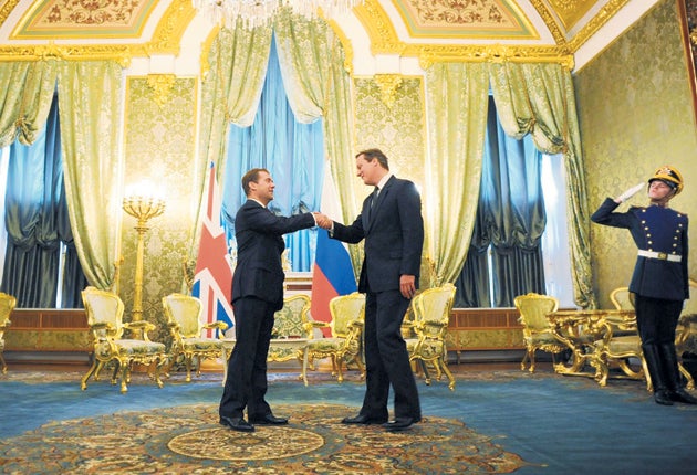 President Dmitry Medvedev, left, greets David Cameron at the Kremlin in Moscow