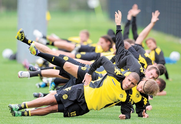 Dortmund's youthful squad are put through their paces yesterday under the watchful eye of coach Jurgen Klopp
