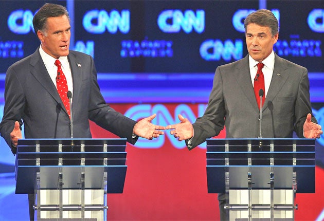 Mitt Romney, left, and Rick Perry during Monday's debate