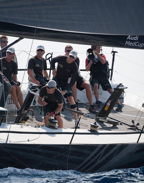Niklas Zennstrom (centre holding tiller extension) with new tactician Morgan Larson to his right drives Ran to the top of the leaderboard at the final 2011 Audi MedCup regatta in Barcelona