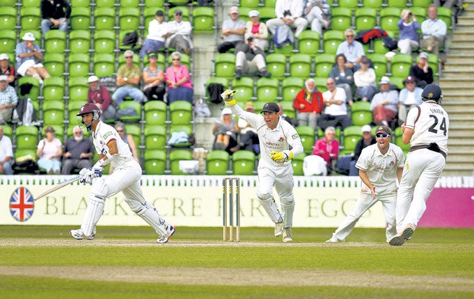 Lancashire all-rounder Tom Smith wheels away in delight after catching Alfonso Thomas