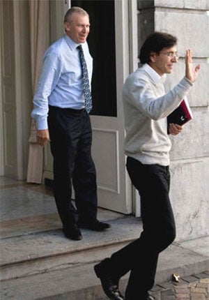 The outgoing caretaker Prime Minister, Yves Leterme, left, and Socialist party leader, Elio Di Rupo