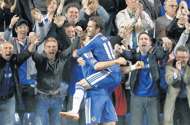 Juan Mata is congratulated by Chelsea team-mate Fernando Torres after scoring against Bayer Leverkusen on Tuesday