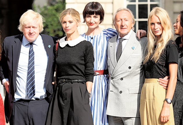 Boris Johnson with Harold Tillman, chairman of the British Fashion Council, and models Laura Bailey, Erin O'Connor and Poppy Delevigne as London Fashion Week opens