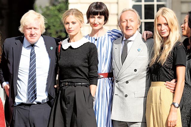 Boris Johnson with Harold  Tillman, chairman of the British Fashion Council, and models Laura Bailey, Erin O'Connor and Poppy Delevigne as London Fashion Week opens