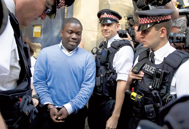 Suspected rogue trader Kweku Adoboli broke down in court, but wore a grimace when led outside