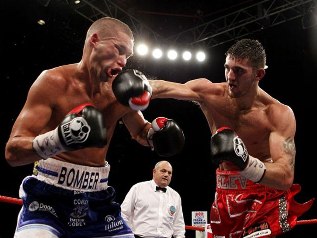 Nathan Cleverly (right) lands a blow on Tony Bellew during their first bout in October 2011