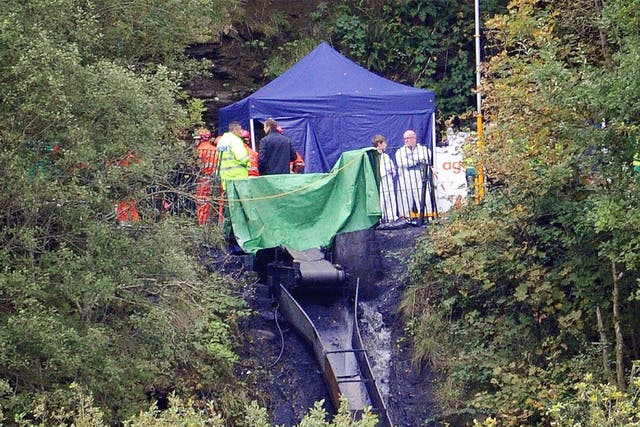<p>Rescue workers at Gleision colliery after the tragedy in September 2011</p>