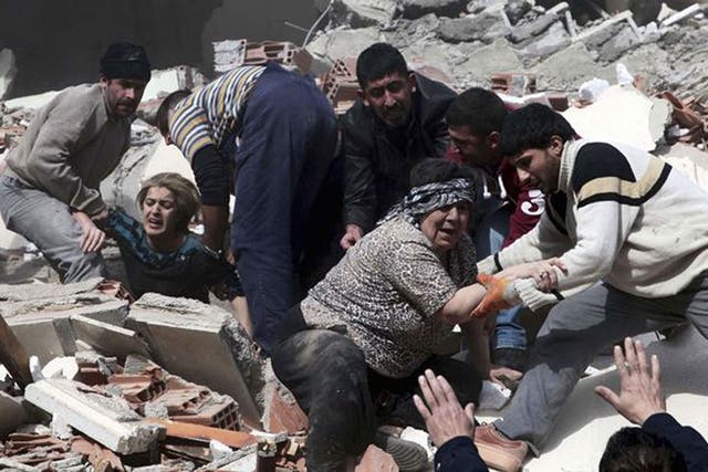 Rescue workers rescue people trapped under debris after an earthquake in a village near the eastern Turkish city of Van. Turkey's Kandilli Observatory estimates that some 500 to 1,000 people were killed in a powerful earthquake in southeast Turkey's Van p