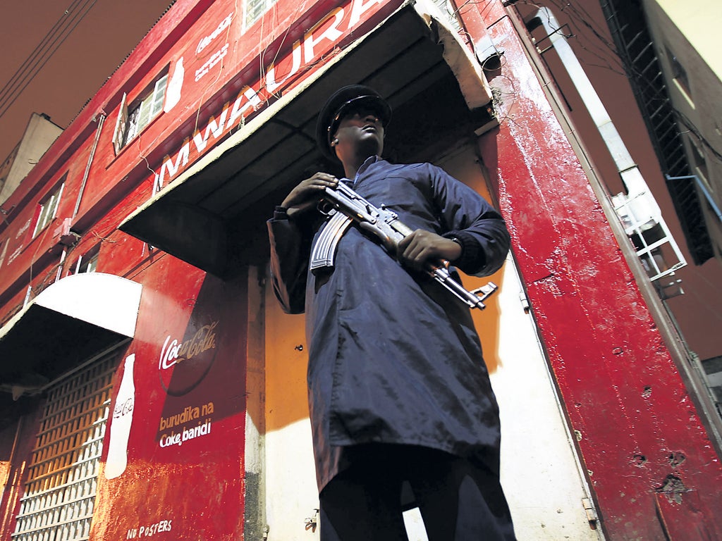 A police officer stands outside the targeted nightclub in Nairobi