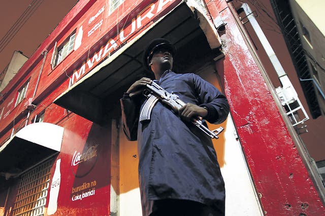 A police officer stands outside the targeted nightclub in Nairobi