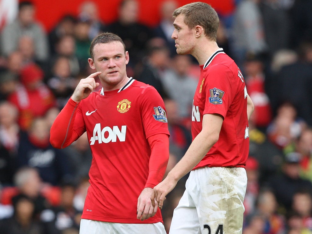 Darren Fletcher (right) and Wayne Rooney are left stunned by the 6-1 defeat to Manchester City